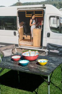 A table with bowls of food on it