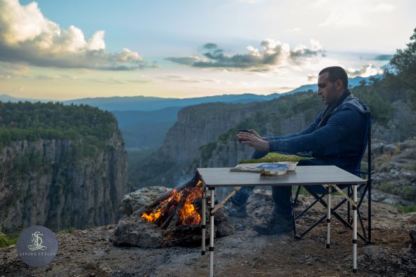 A man sitting at the table with food in front of him.