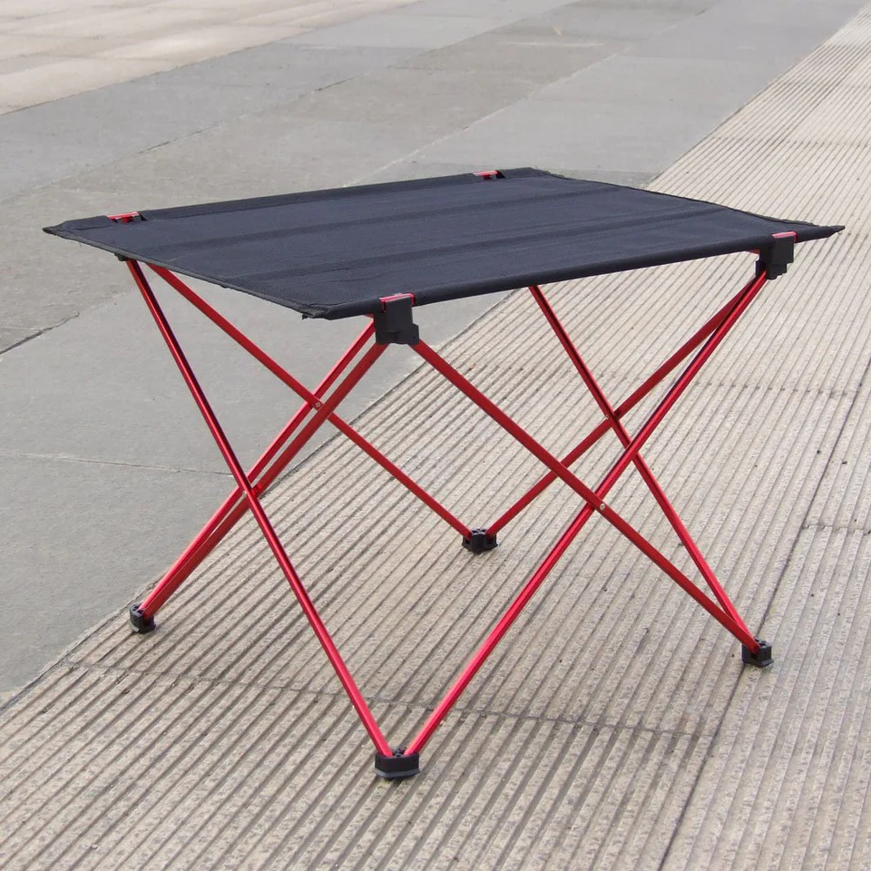 A folding table is sitting on the ground.