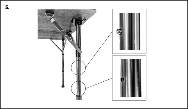 A close up of the side of a table with two poles attached to it.