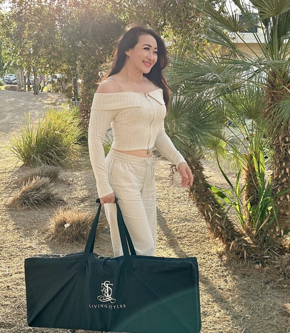 A woman in white top holding a bag